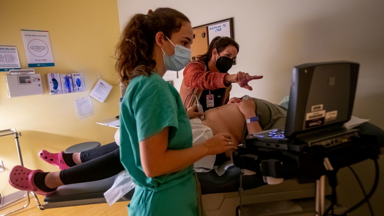 A family physician and her resident perform an ultrasound on a 25-year-old woman the day before the Supreme Court overturned Roe v. Wade at the Center for Reproductive Health clinic on Thursday, June 23, 2022, in Albuquerque, New Mexico.