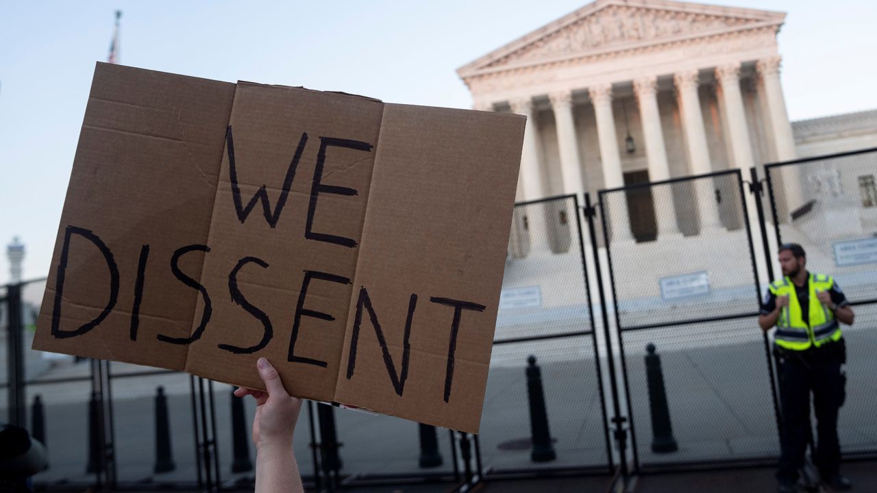 A protester holds a placard outside the U.S. Supreme Court in Washington, D.C., the United States, June 24, 2022. 