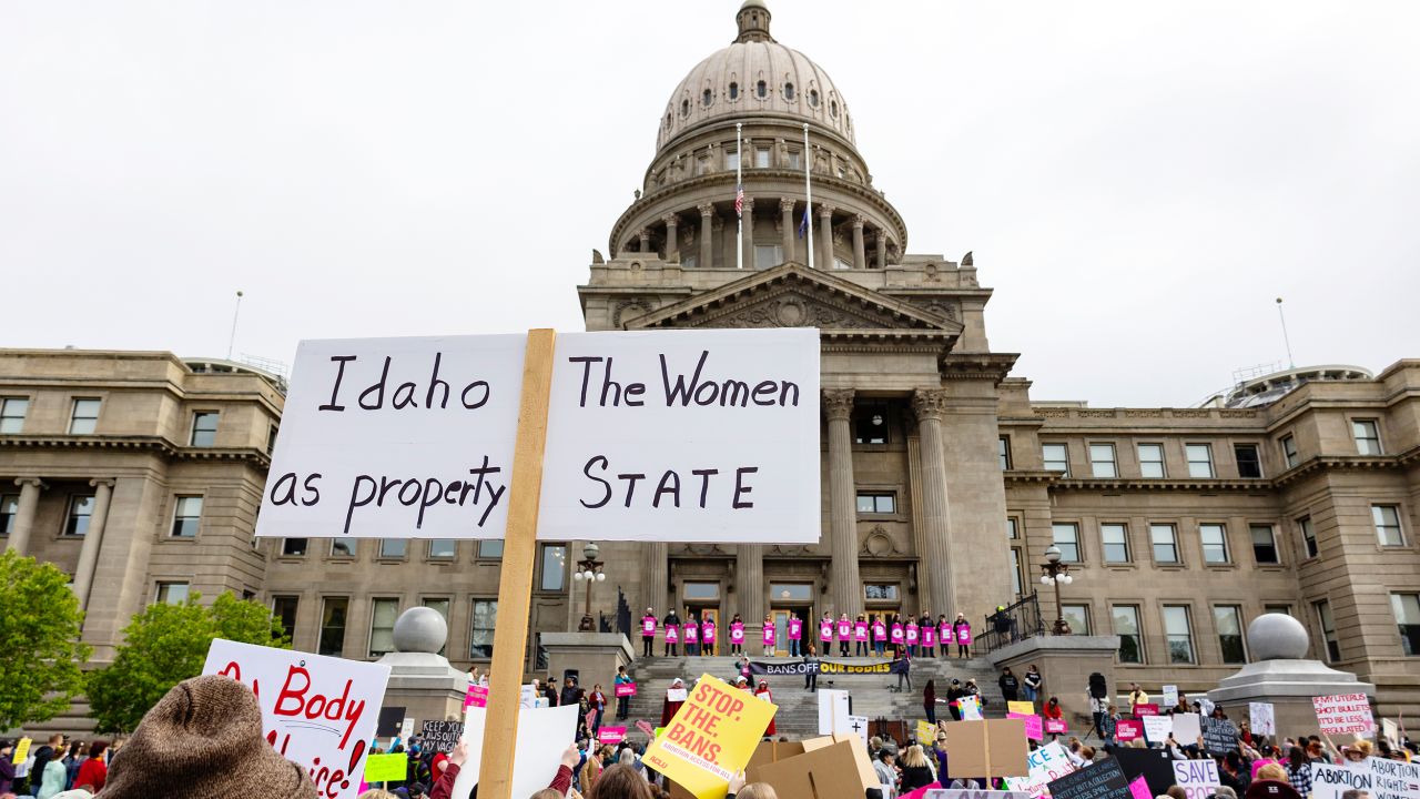 An attendee at a rally for abortion rights holds a sign outside the Idaho Statehouse in downtown Boise on May 14, 2022.