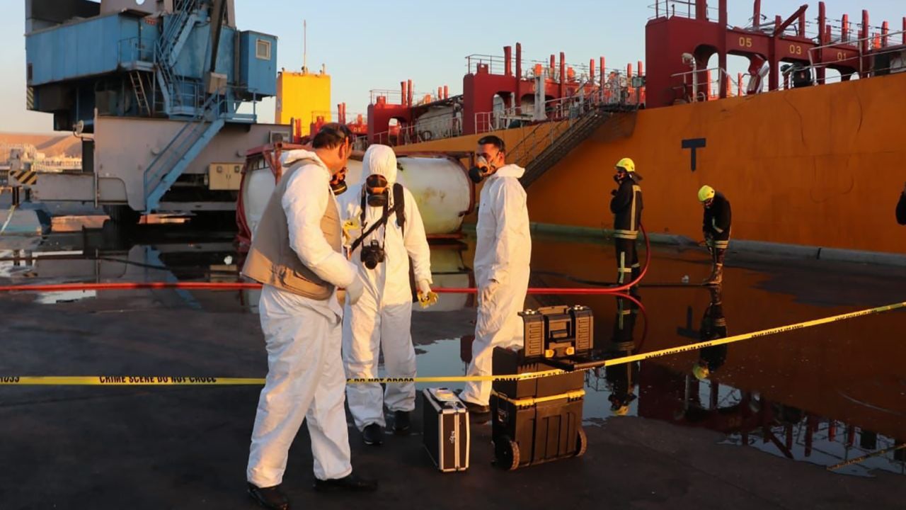 Workers in hazmat suits respond to the toxic gas leak at Jordan's port of Aqaba on Monday.