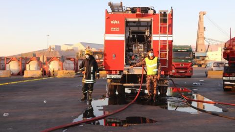 Emergency response teams respond to the toxic gas leak at the port of Aqaba in Jordan on Monday.