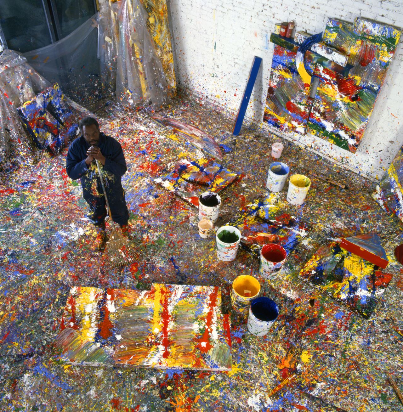 Gilliam poses in his paint-splattered studio in Washington, DC in 1980.