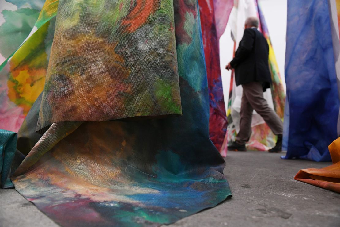 A man walks past Gilliam's work "untitled" during the preview day of Art Basel in 2018.