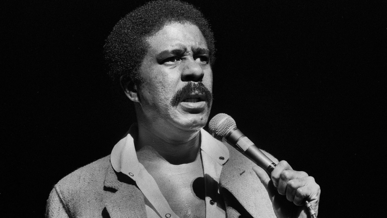 Richard Pryor performing on stage in Chicago as seen in 'Right to Offend: The Black Comedy Revolution.'