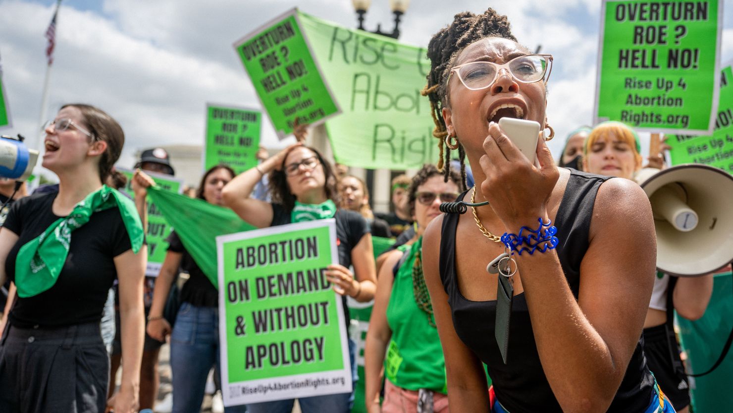 Abortion rights demonstrator Elizabeth White leads a chant in response to the Dobbs v. Jackson Women's Health Organization ruling in front of the Supreme Court on June 24, 2022.