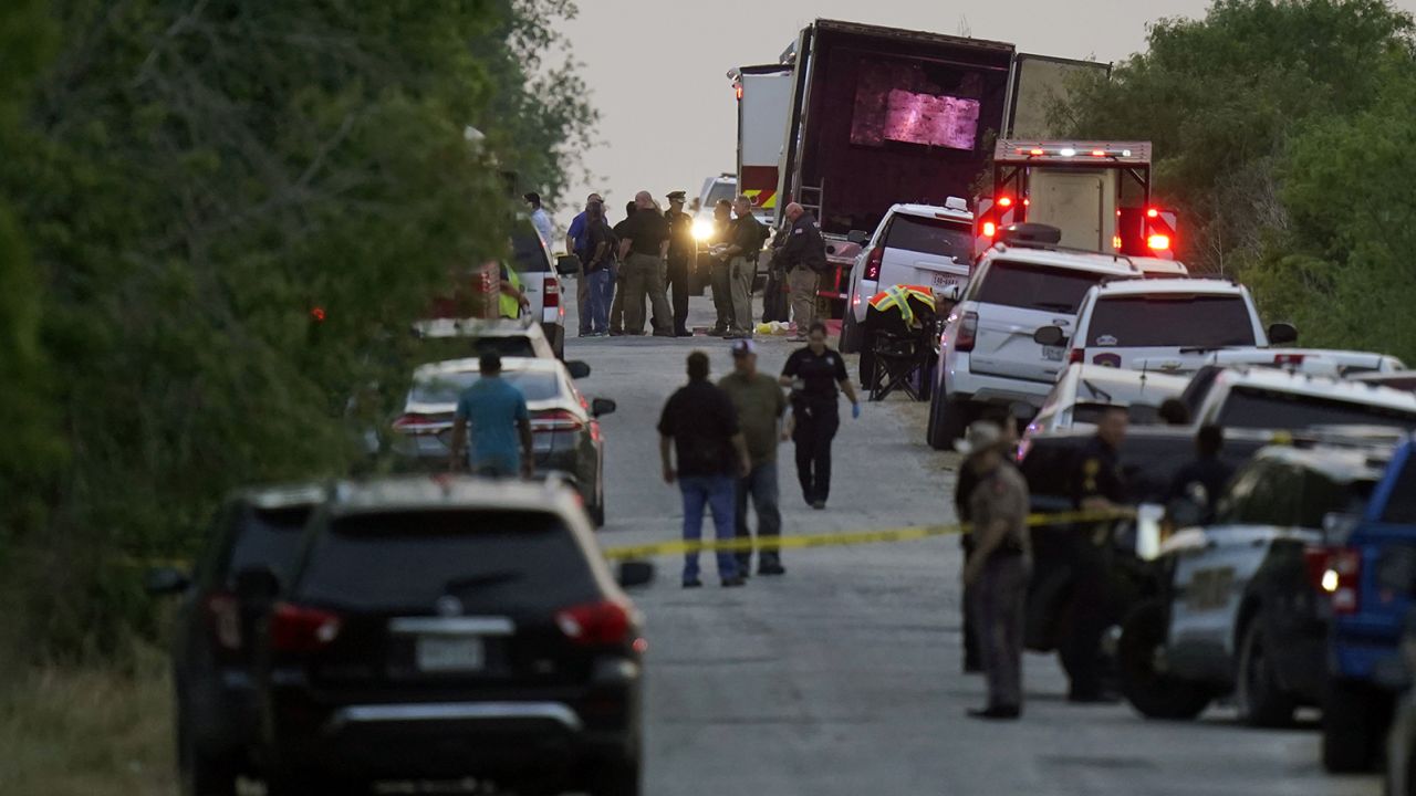 Police and other first responders work at the place where dozens of migrants were found dead Monday in San Antonio. 
