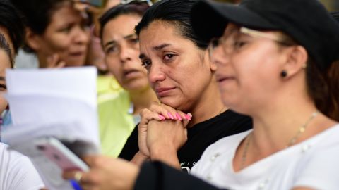 Relatives of inmates at the Tulua prison in Colombia wait outside the facility after the deadly incident on Tuesday. 