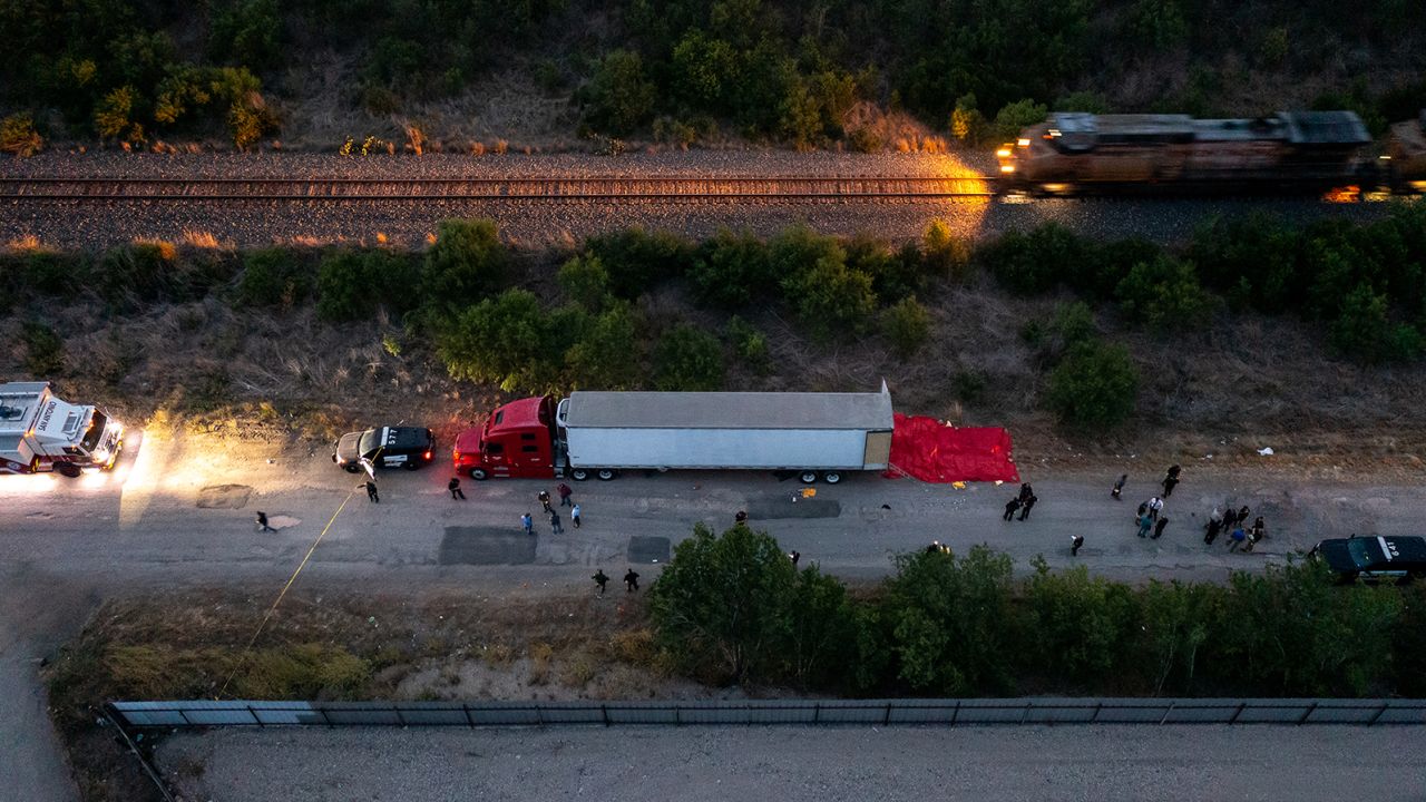 Members of law enforcement investigate the tractor-trailer on June 27, 2022 in San Antonio, Texas. 