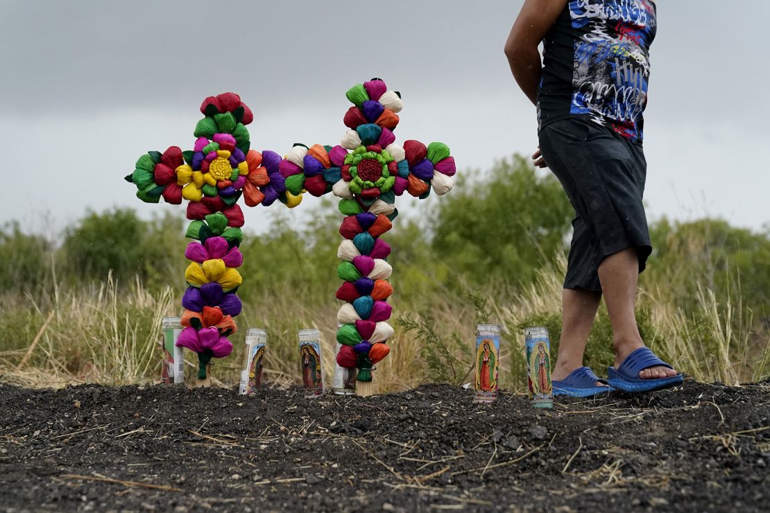 A man pays his respects at a makeshift memorial for the victims in San Antonio.