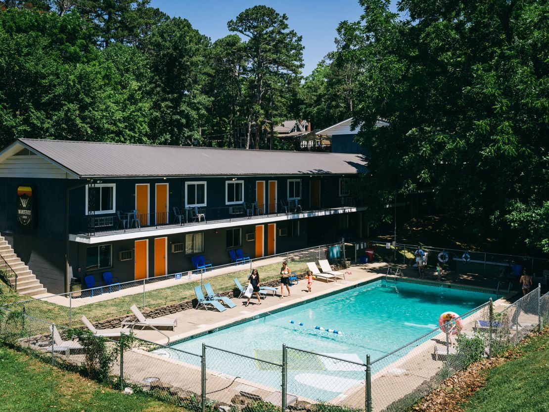 People head to the pool at the Wanderoo Lodge in Eureka Springs on June 21.