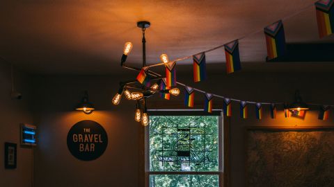 Flags hang from the Gravel Bar's ceiling at Wanderoo Lodge on June 21.