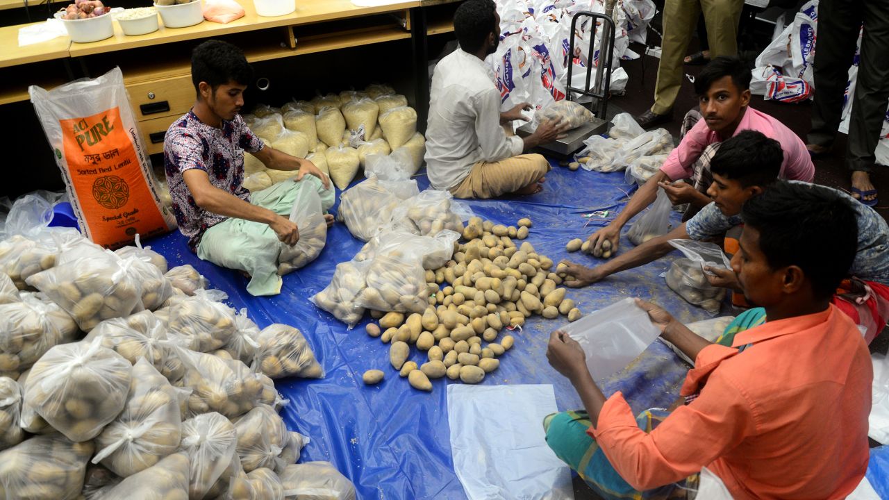 Volunteers pack relief materials for flood affected people in Dhaka, Bangladesh, on June 24.