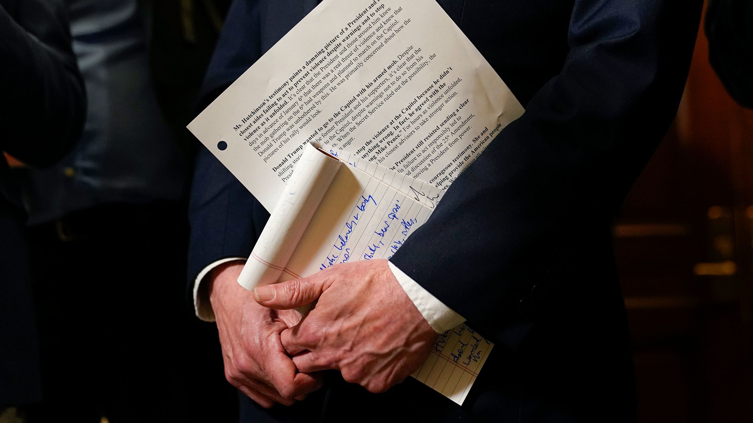 Raskin holds his notes while speaking to journalists on June 28.