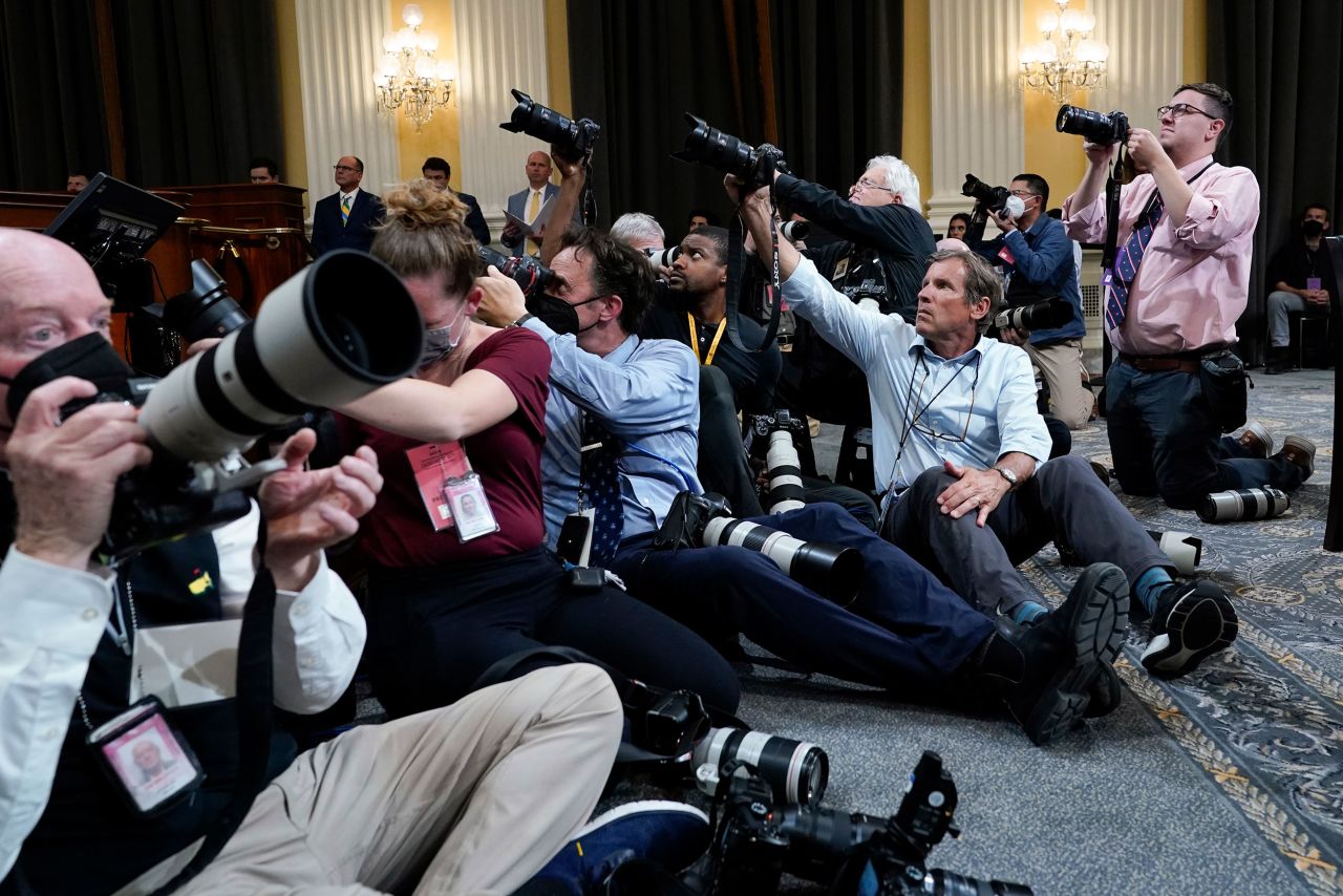 Photographers document the hearing on June 28.