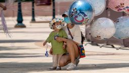A child looks at balloons at the Shanghai Disneytown on June 16, 2022 in Shanghai, China. 