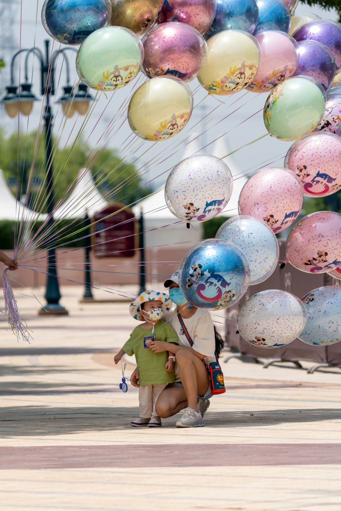A child looks at balloons at the Shanghai Disneytown on June 16, 2022 in Shanghai, China.