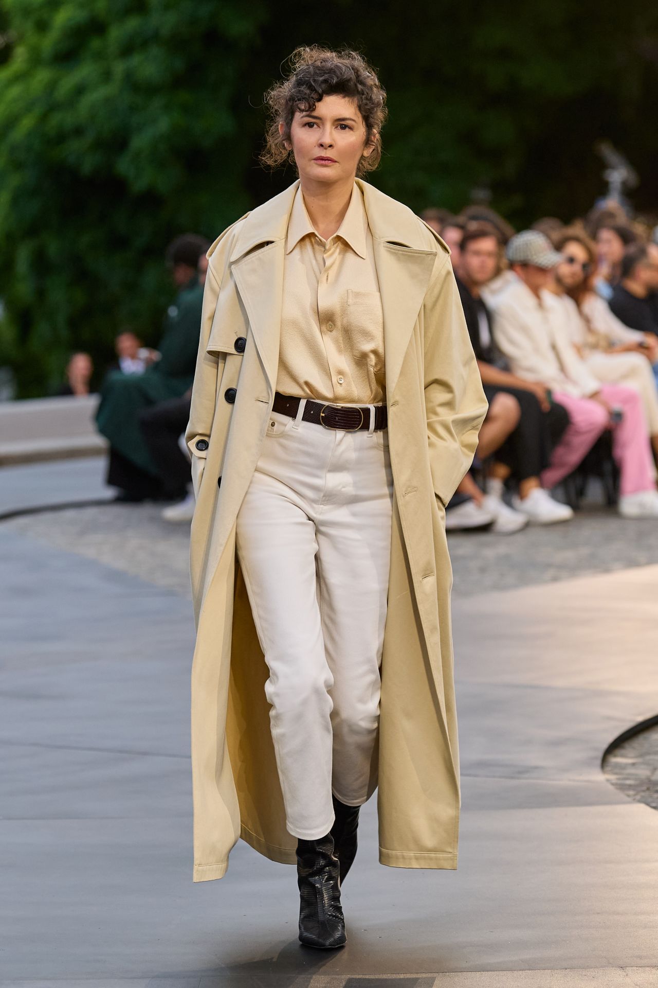 Audrey Tautou, the French actress, walked in the Ami show wearing a classic Parisian trench coat.