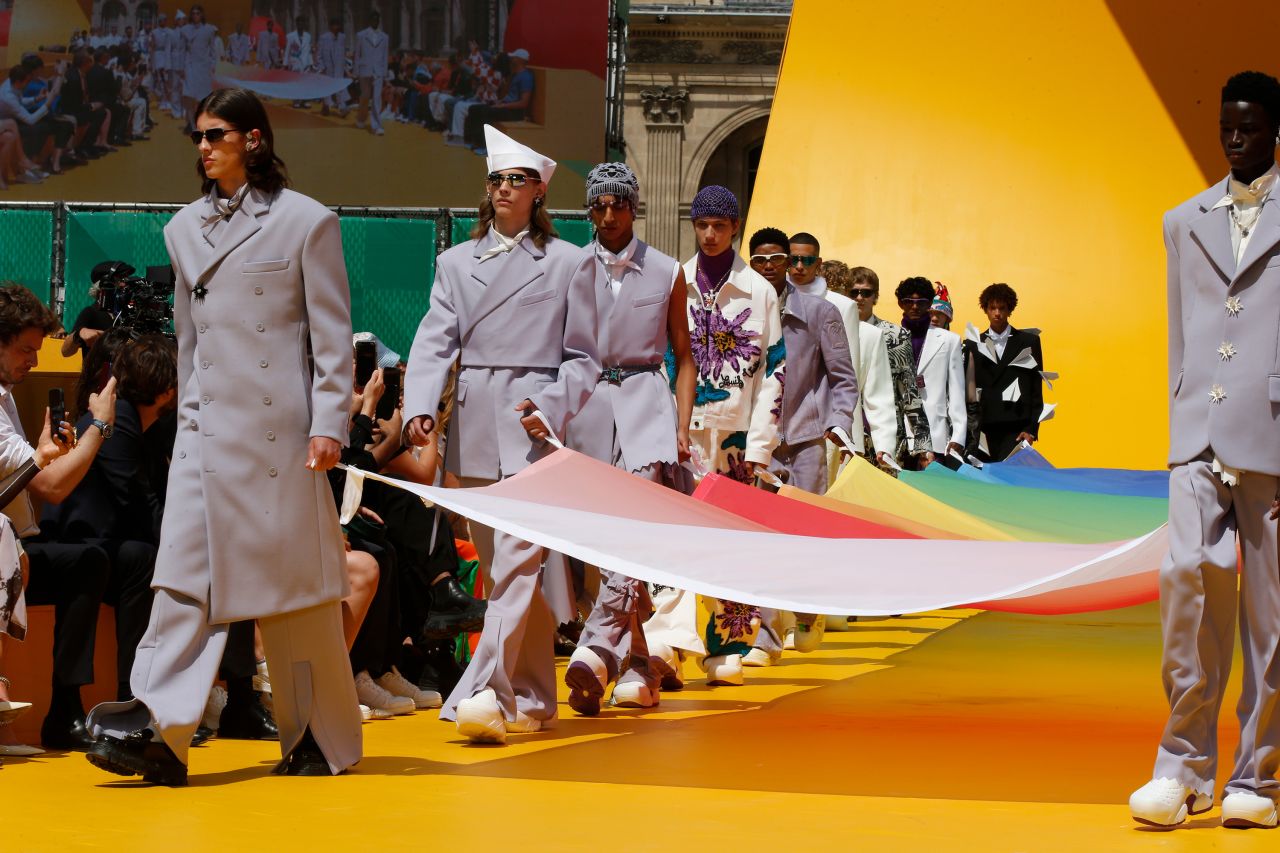 A giant rainbow flag was paraded onto the stage at the Louis Vuitton finale.