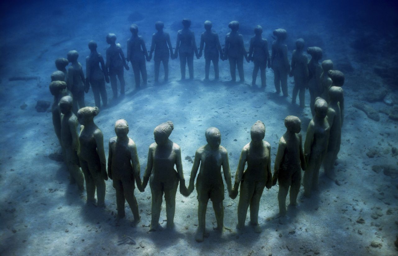 "Vicissitudes," featuring a ring of children of diverse backgrounds holding hands is a symbol of unity and resilience.