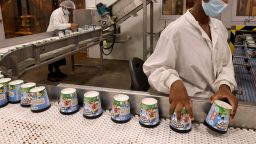 A labourer works on a production line filling ice-cream pots at the Ben & Jerry's factory in Be'er Tuvia in southern Israel, on July 21, 2021. 