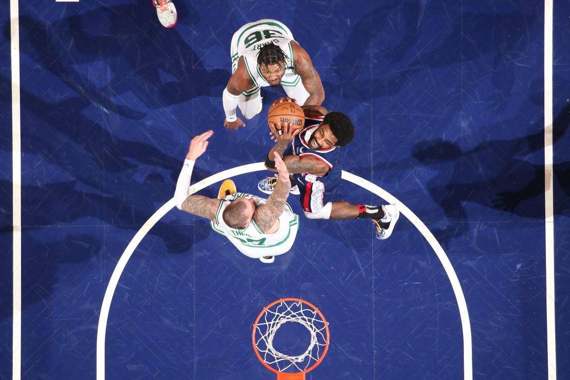 Irving drives to the basket against the Celtics during the 2022 NBA Playoffs.