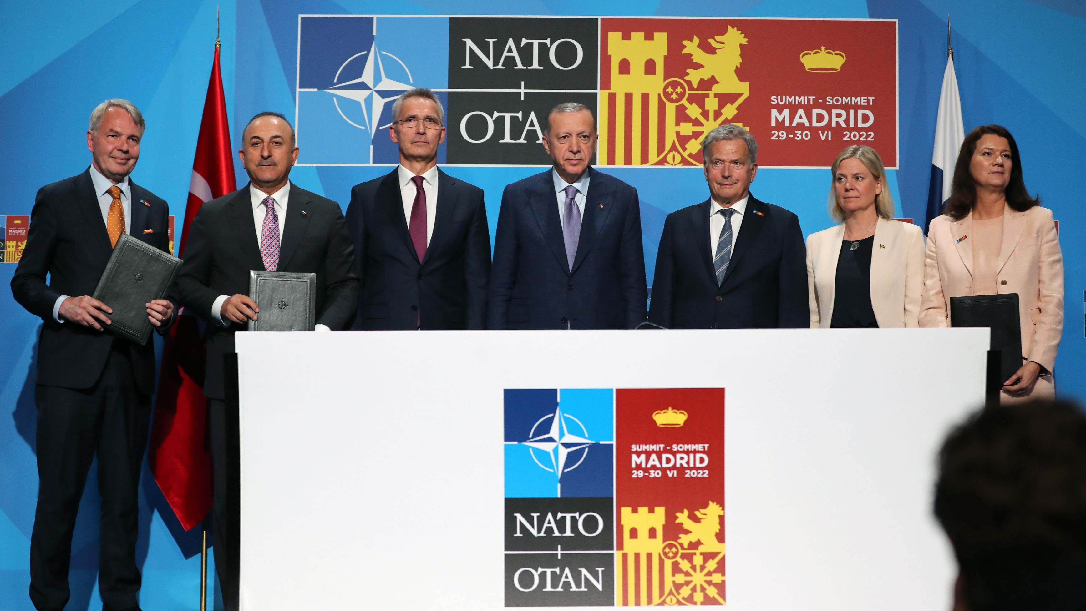 Turkish President Recep Tayyip Erdogan (center), NATO Secretary-General Jens Stoltenberg (third from left), Finland's President Sauli Niinisto (fifth from left), Sweden's Prime Minister Magdalena Andersson (sixth from left) and other officials attend a signing ceremony of a memorandum on the Nordic countries' NATO bids in Madrid, Spain on June 28.