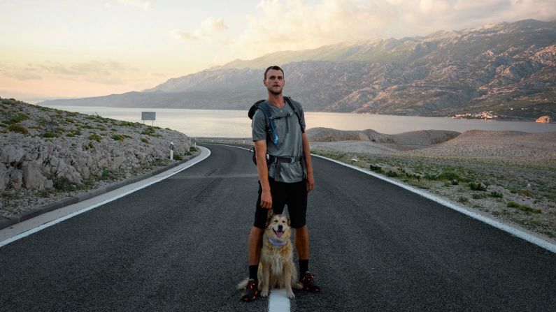 <strong>Constant companion:</strong> Turcich, seen with Savannah in Pag, Croatia, began the trip alone, but went on to adopt the canine, who was a puppy at the time, from an animal shelter in Austin, Texas, during the first leg of his trip.