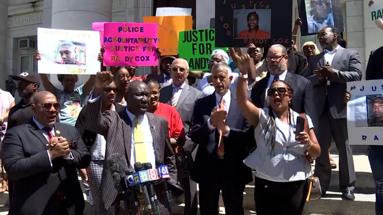 Family members of Richard "Randy" Cox Jr. and his legal team, including attorney Ben Crump, call for justice Tuesday at a press conference. 