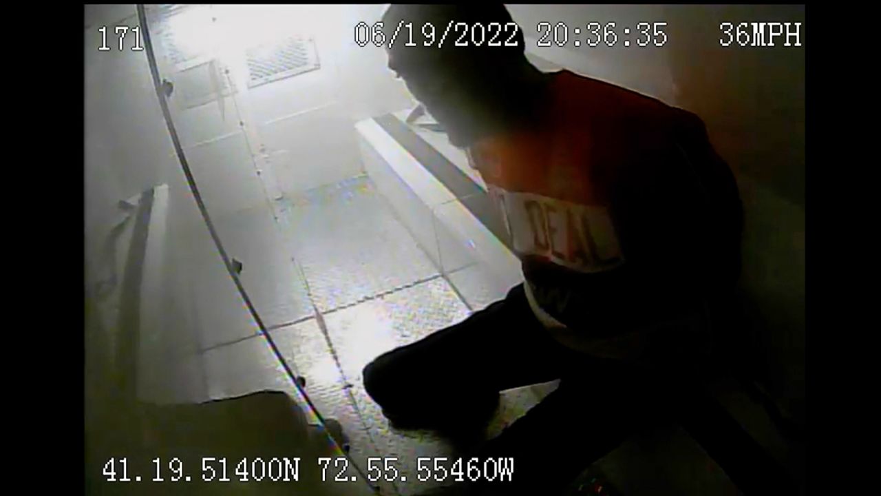 Randy Cox Jr., 36, is seen inside a police van after being arrested by New Haven officers.
