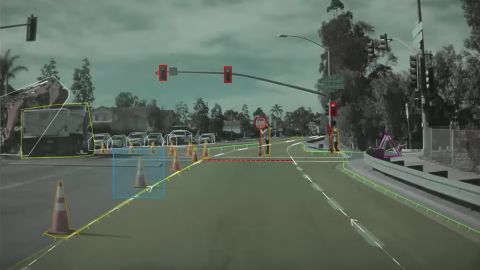 A screenshot from Tesla's 2021 AI Day shows the common industry practice of labeling images to help a self-driving car understand its environment.