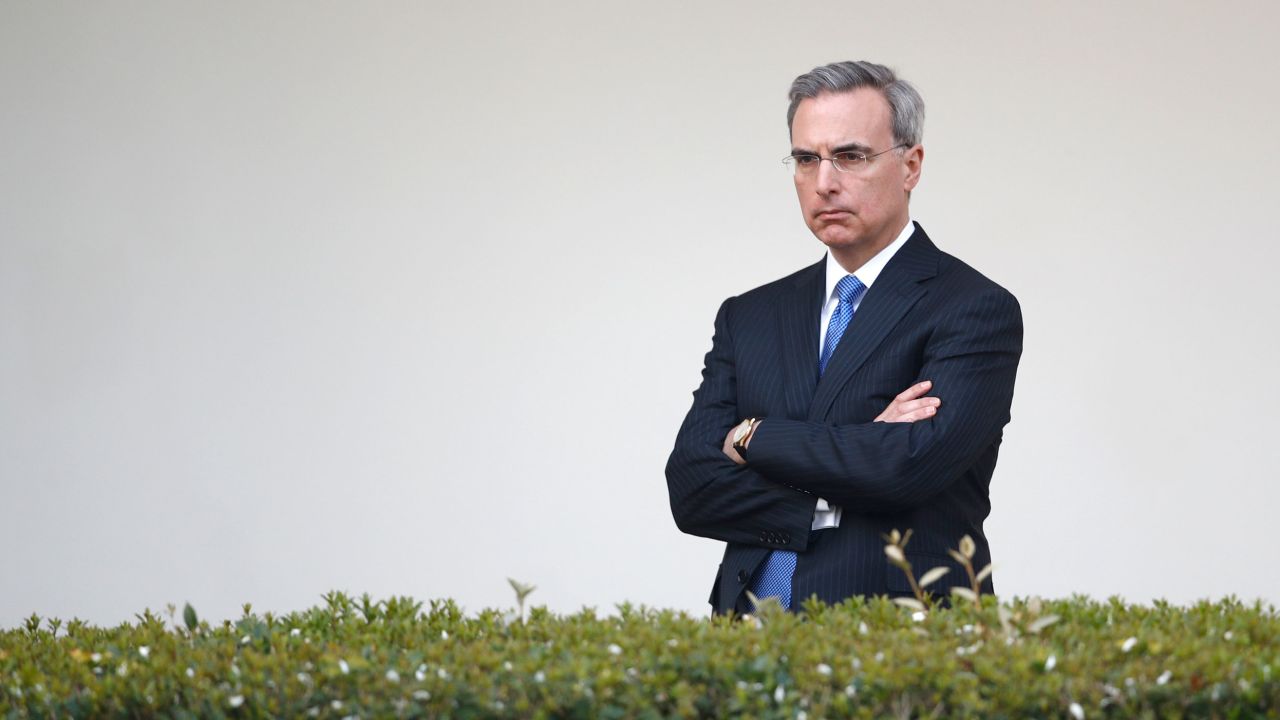 White House counsel Pat Cipollone listens as President Donald Trump speaks during a coronavirus task force briefing in the Rose Garden of the White House, Sunday, March 29, 2020, in Washington. 