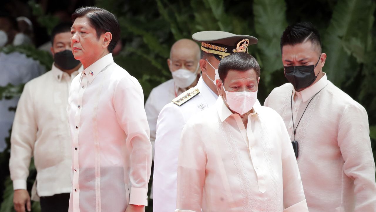Incoming Philippine President Ferdinand Marcos Jr. and outgoing President Rodrigo Duterte take part in the inauguration ceremony for Marcos at the Malacanang presidential palace grounds in Manila on June 30.