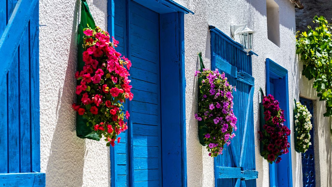 Alacati's cobbled alleyways are filled with brightly colored houses.