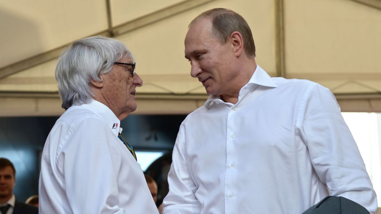 Russian President Vladimir Putin (right) and Bernie Ecclestone shake hands during the inaugural Russian Grand Prix at the Sochi Autodrom in Sochi on October 12, 2014. 