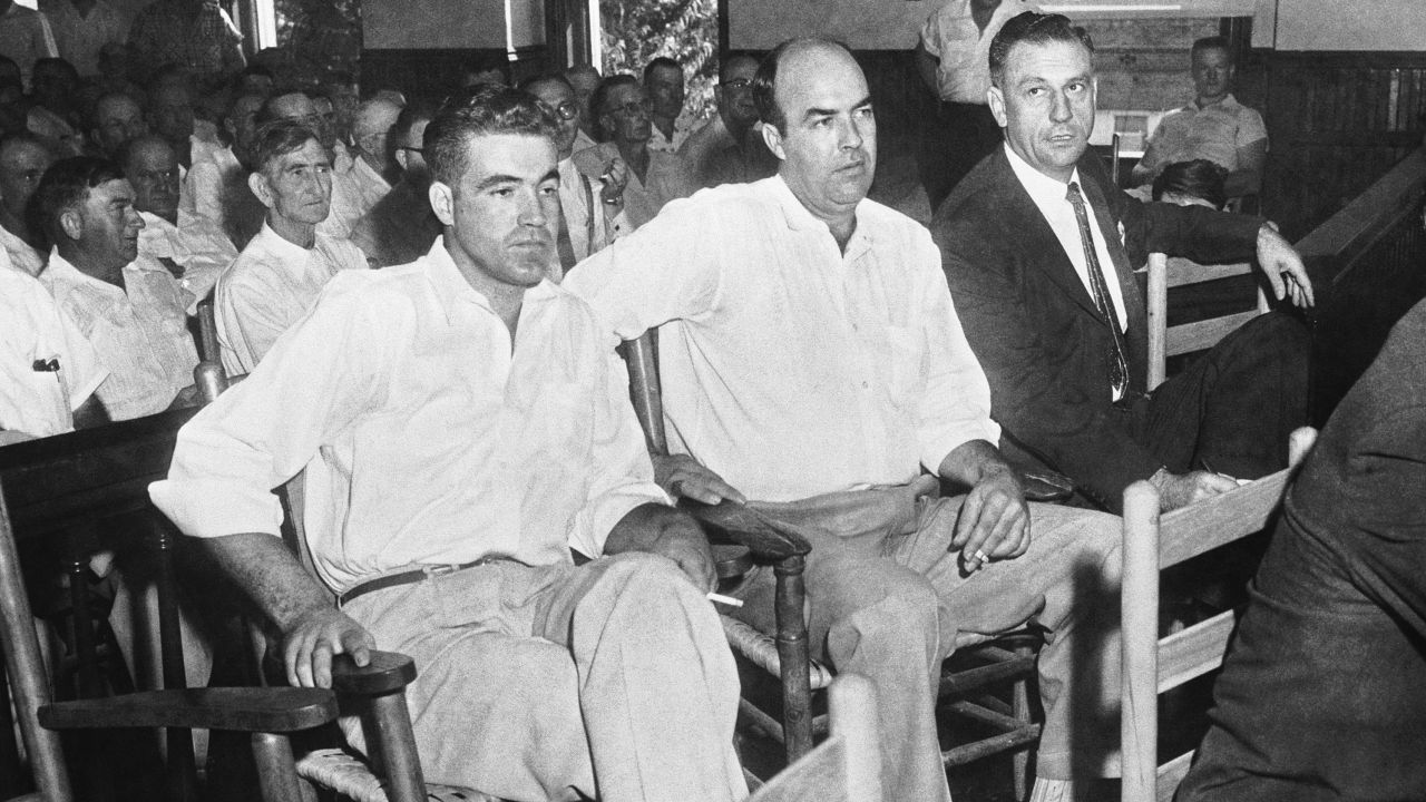 Half-brothers Roy Bryant, left, and J.W. Milam, center, sit with an attorney as they stand trial for the murder of Emmett Till.