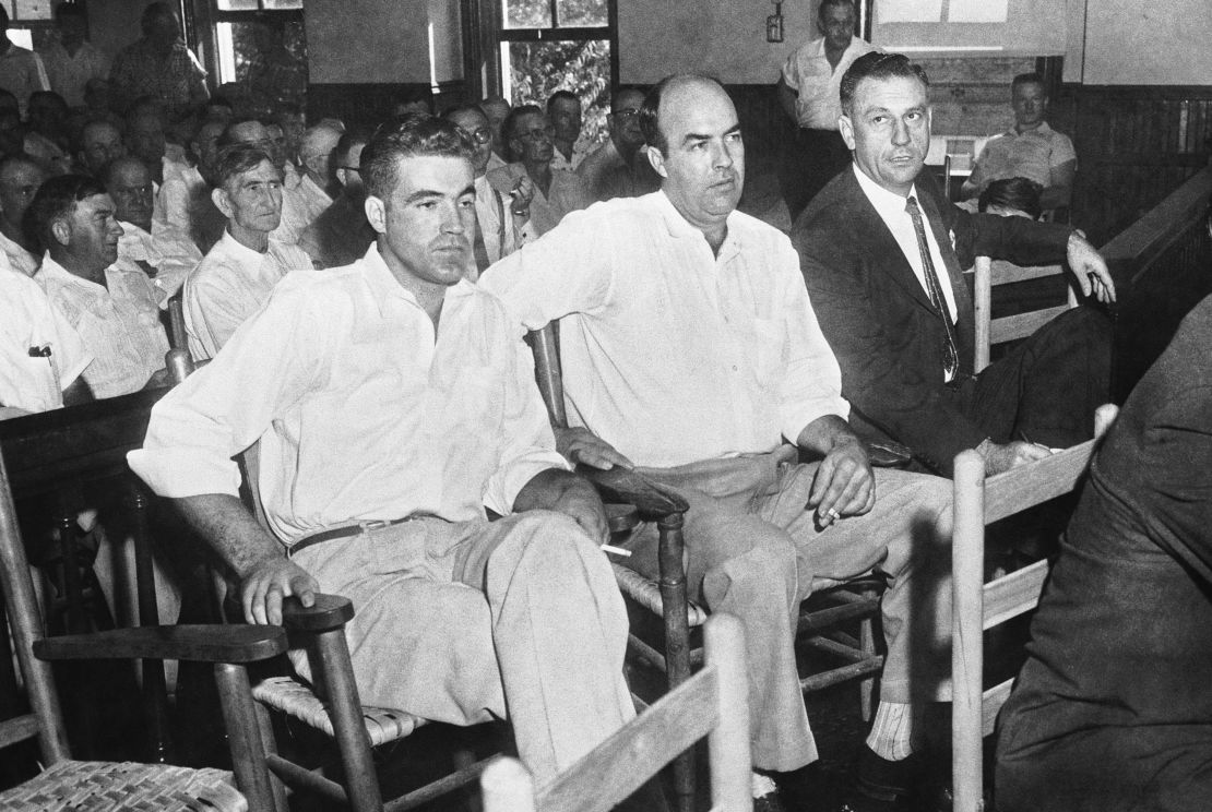 Half-brothers Roy Bryant, left, and J.W. Milam, center, sit with an attorney as they stand trial for the murder of Emmett Till.