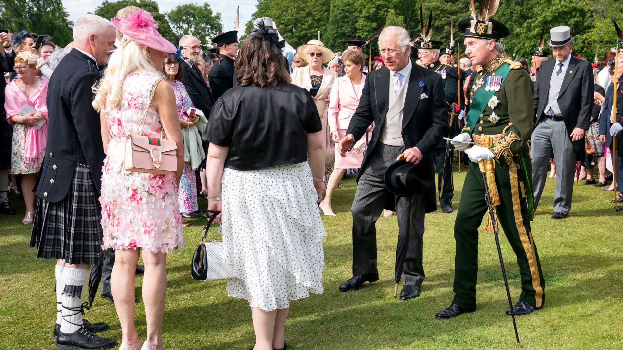 Prince Charles -- who's known in Scotland as the Duke of Rothesay -- appeared quite animated during a garden party at Holyroodhouse on Wednesday. The event sees thousands invited to spend a relaxed afternoon in the palace's verdant grounds, where royals mingle with guests, and regimental bands and the Royal Scottish Pipers' Society perform.