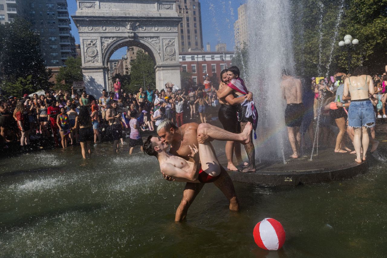A couple kisses in a fountain in New York's Washington Square Park as people take part in the Queer Liberation March on Sunday, June 26.