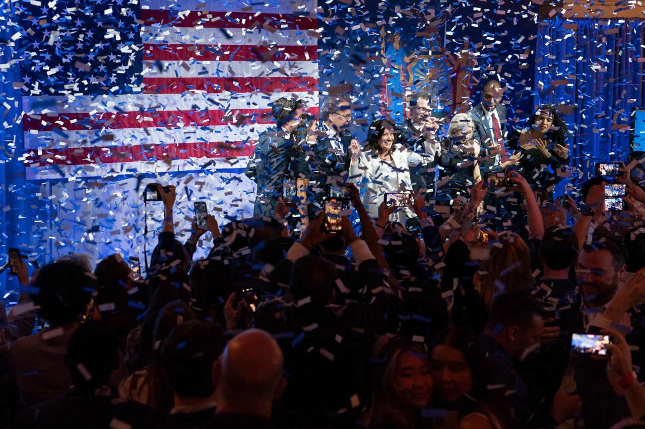 New York Gov. Kathy Hochul, third from left, celebrates on stage after <a href="https://www.cnn.com/politics/live-news/primary-election-results-illinois-colorado-ny-2022/h_933272d020dc6606cedc7c5a0d139225?ref=upstract.com&curator=upstract.com&utm_source=upstract.com" target="_blank">winning the Democratic primary</a> on Tuesday, June 28.