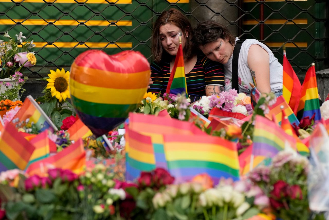 People comfort each other at the scene of a <a href="https://www.cnn.com/2022/06/24/europe/norway-oslo-gay-bar-shooting-intl-hnk/index.html" target="_blank">deadly shooting</a> in Oslo, Norway, on Saturday, June 25. Oslo's annual Pride parade was canceled following the shooting near the London Pub, which describes itself on its website as "the largest gay and lesbian venue in Oslo." Two people were killed and eight were taken to the hospital.