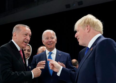 From left, Turkish President Recep Tayyip Erdogan, US President Joe Biden and British Prime Minister Boris Johnson speak while attending a <a href=