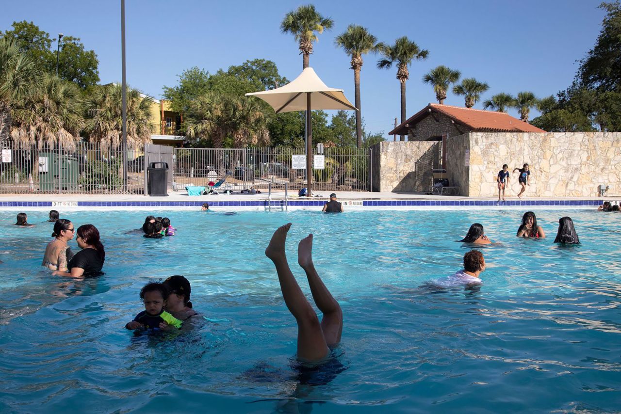 Ciaralyn Dysart does a handstand in a San Antonio public pool that had just opened for the season on Friday, June 24. Millions of Americans were under heat advisories and looking for ways <a href="https://www.cnn.com/2022/06/26/us/gallery/san-antonio-heat/index.html" target="_blank">to cope with the scorching temperatures.</a>