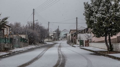 A general view of the village of Akreni covered with snow during the winter.