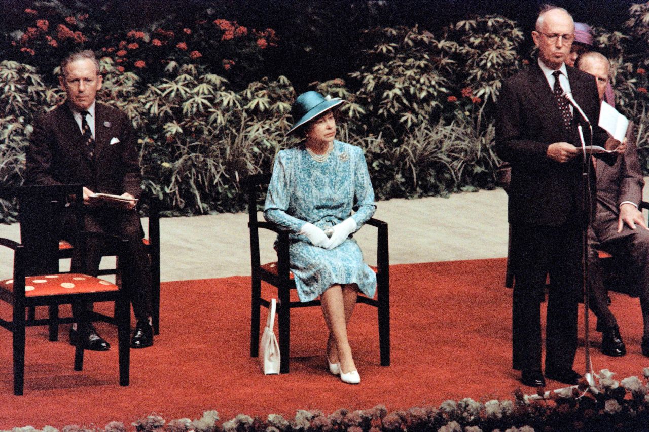 Britain's Queen Elizabeth II listens to Hong Kong Governor Edward Youde during a welcoming ceremony at Hong Kong's City Hall in 1986.