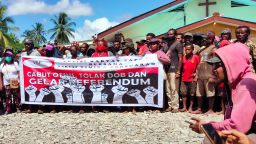 Papuans hold a demonstration against the government's plan to form a new autonomous region, in Timika on June 3, 2022, and called for a referendum, as well of rejected military operations, and demanded the release of pro-independence Papuan activists. (Photo by SALDI HERMANTO / AFP) (Photo by SALDI HERMANTO/AFP via Getty Images)