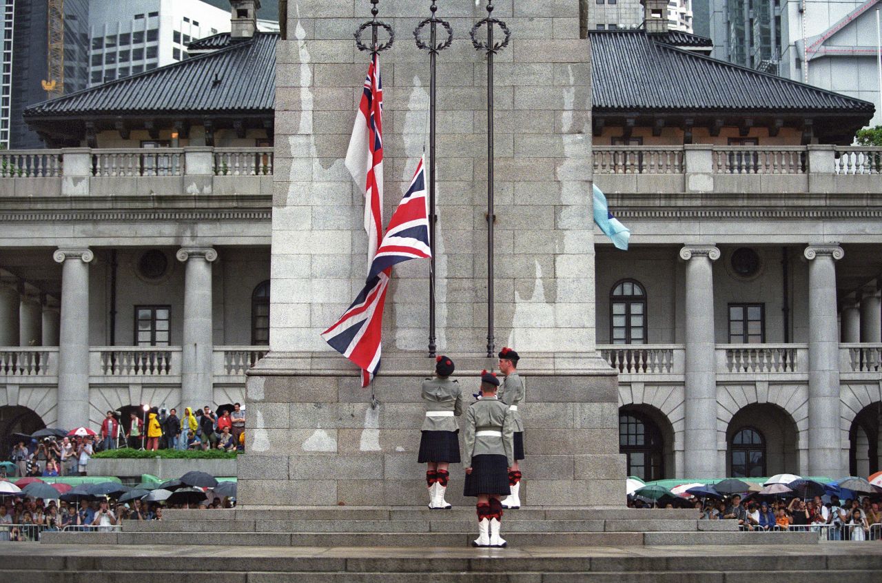Three British soldiers lower the Union Jack flag at the Cenotaph monument in Hong Kong on June 30, 1997, hours before the end of British colonial rule.