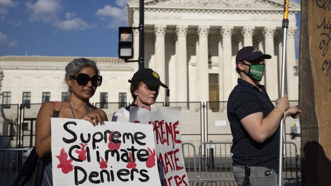 Climate activists protest outside the US Supreme Court on June 30, 2022. 