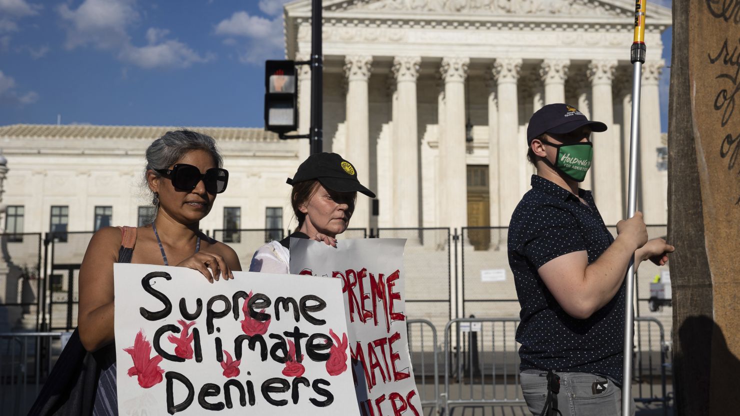 Climate activists protest outside the US Supreme Court on June 30, 2022. 