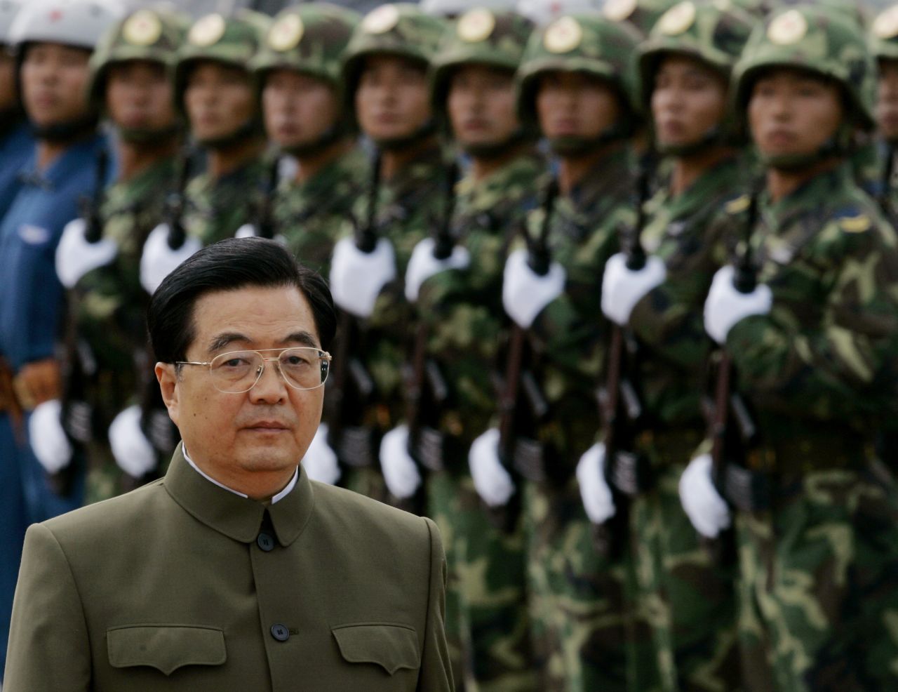Chinese leader Hu Jintao inspects troops stationed in Hong Kong in 2007. Hu was on a weekend visit to Hong Kong to oversee the 10th anniversary of the city's handover to Chinese rule.