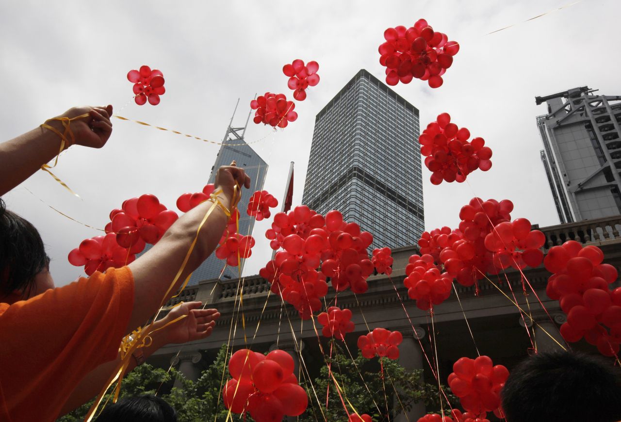 People release red balloons in 2011 to celebrate the 14th anniversary of Hong Kong's handover to China.